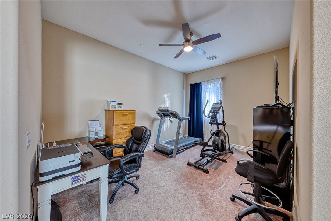 70 Portezza Drive, Henderson, NV 89011 Transform this versatile room into a productive home office and personal gym space.