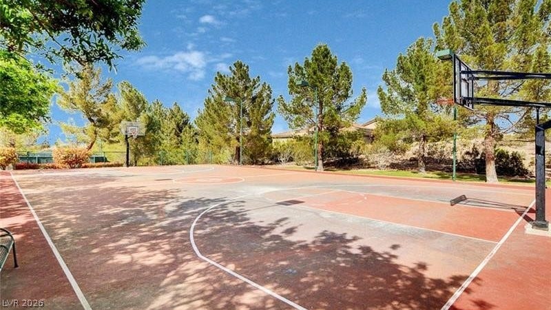 An outdoor basketball court beckons for active recreation within this property's community amenities.