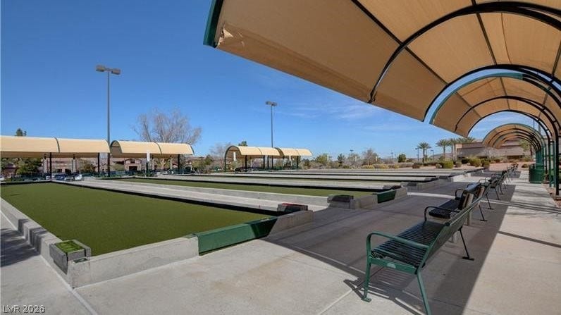 Bocce ball courts offer recreation under shaded structures, with ample seating for players and spectators alike.