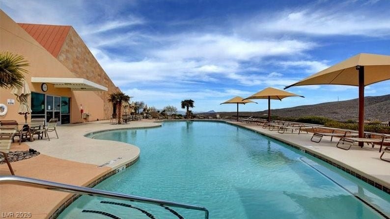 An inviting community pool with ample lounging space offers refreshing outdoor recreation.
