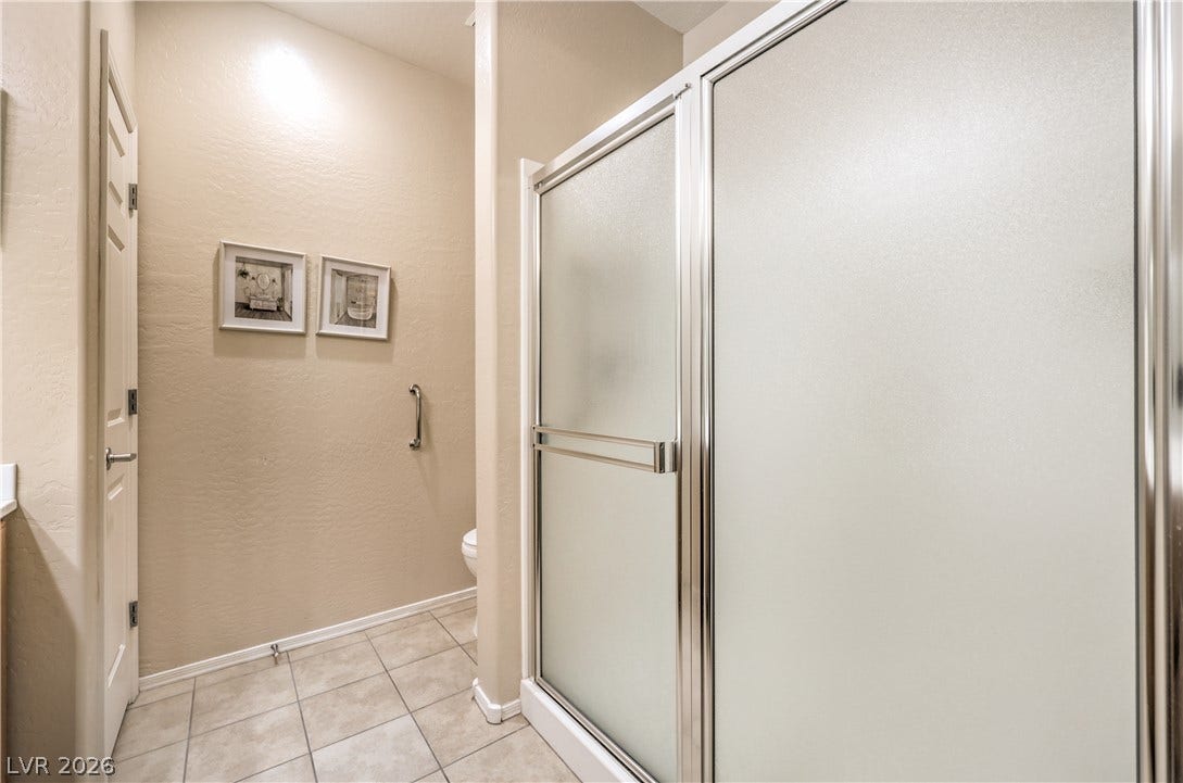2439 Erastus Drive, Henderson, NV 89044 Primary Bath with Raised Vanity, Dual Sinks, Shower, Comfort Height Toilet, and Tile Flooring