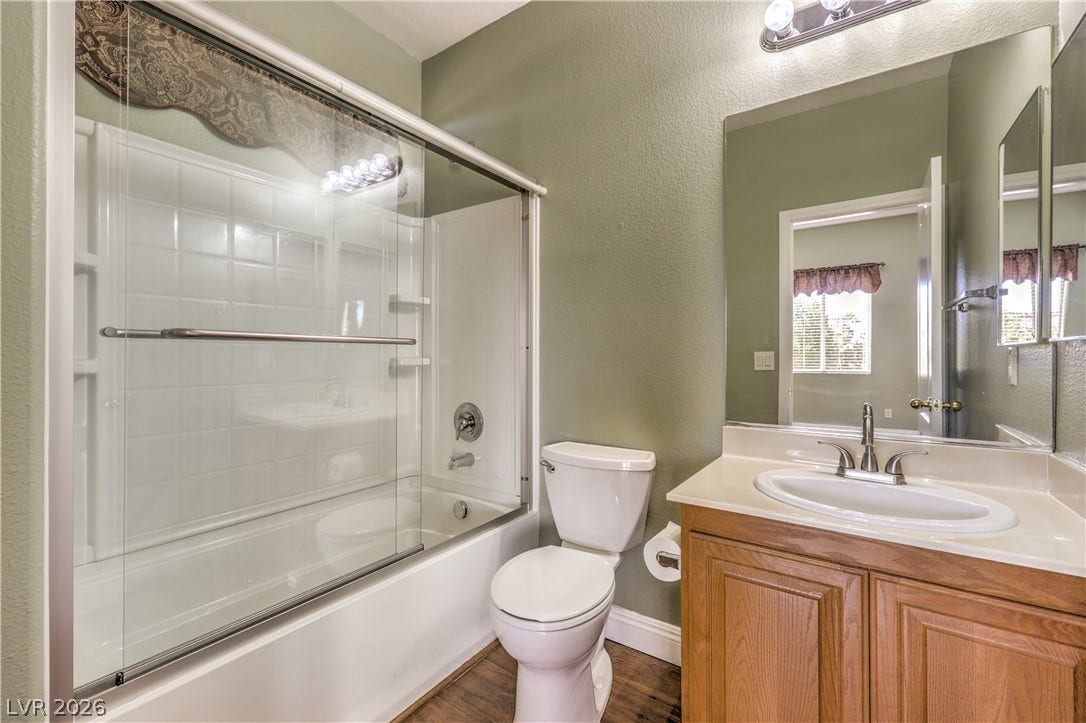 260 Quail Ranch Drive, Henderson, NV 89015 A well-maintained bathroom provides a convenient tub-shower combination and a vanity with ample counter space.
