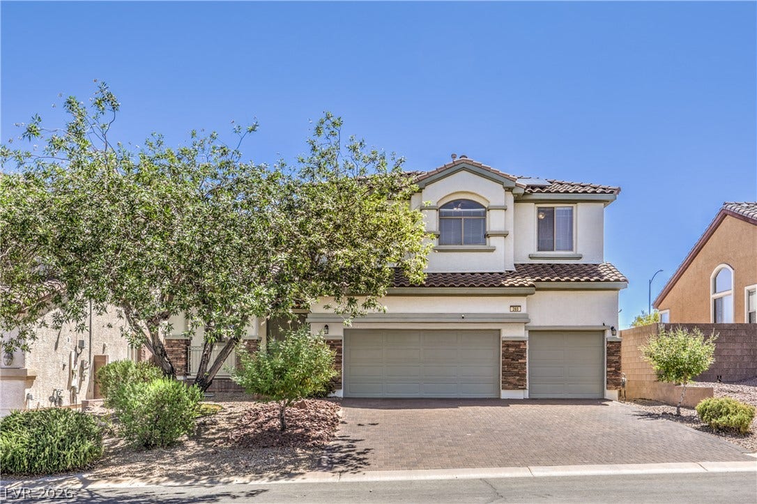 260 Quail Ranch Drive, Henderson, NV 89015 A well-maintained facade features an attached garage and desert landscaping for effortless curb appeal.