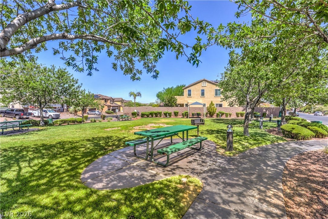 260 Quail Ranch Drive, Henderson, NV 89015 A community park with picnic areas and a paved pathway offers residents a pleasant outdoor retreat.