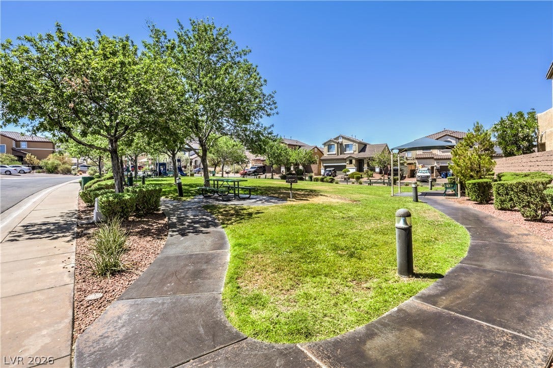 260 Quail Ranch Drive, Henderson, NV 89015 Green spaces and pathways invite strolls and outdoor leisure within this inviting residential community.