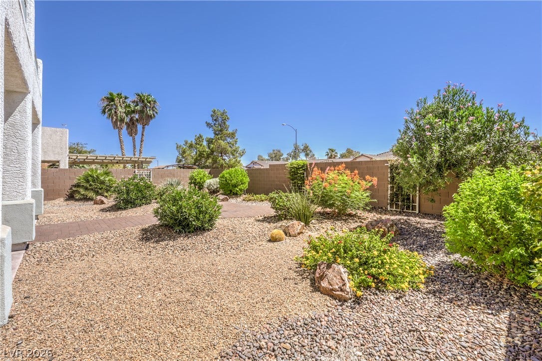 260 Quail Ranch Drive, Henderson, NV 89015 A well-maintained yard offers low-maintenance landscaping and desert flora.