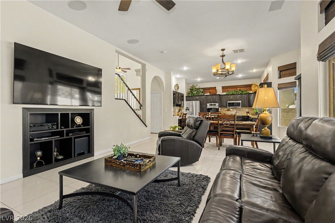 118 Serramonte Court, Henderson, NV 89074 An inviting open-concept living area flows seamlessly into the kitchen and dining space, perfect for entertaining.