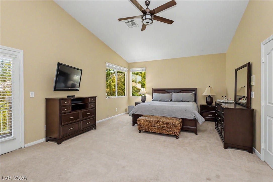 118 Serramonte Court, Henderson, NV 89074 Sloping ceilings and multiple windows enhance this sun-filled bedroom.