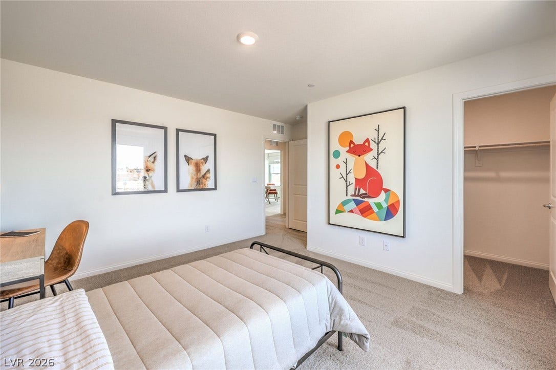 1030 PEACOCK PLUME Avenue, Henderson, NV 89011 Bedroom with light carpet, a walk in closet, baseboards, and recessed lighting. Photo is representational only; actual home finishes may vary.