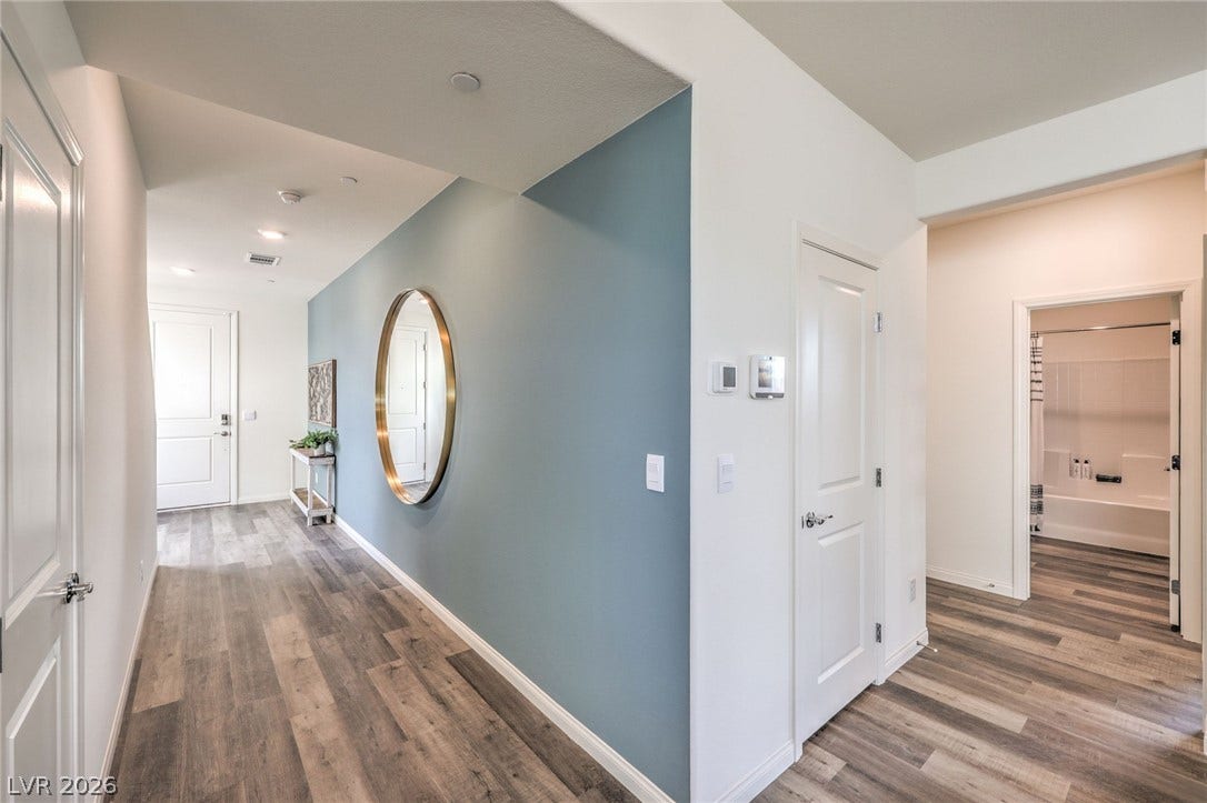 1030 PEACOCK PLUME Avenue, Henderson, NV 89011 Corridor with wood finished floors, baseboards, and recessed lighting