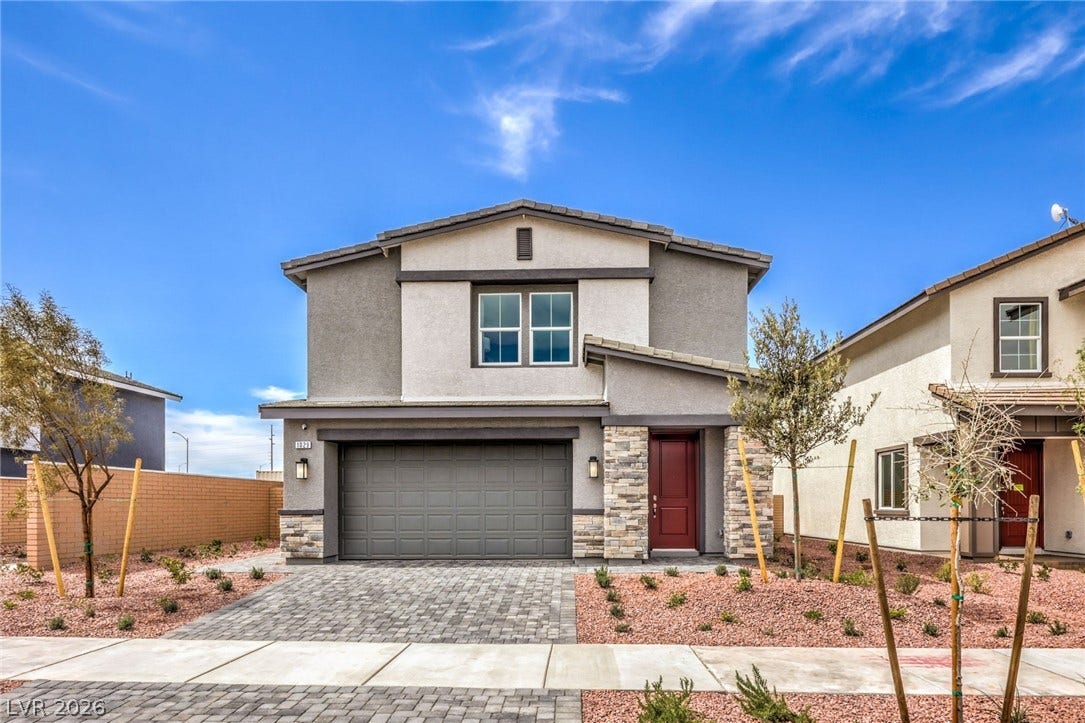 1030 PEACOCK PLUME Avenue, Henderson, NV 89011 Photo is representational only; actual home finishes may vary. Traditional-style home with an attached garage, stucco siding, decorative driveway, and stone siding