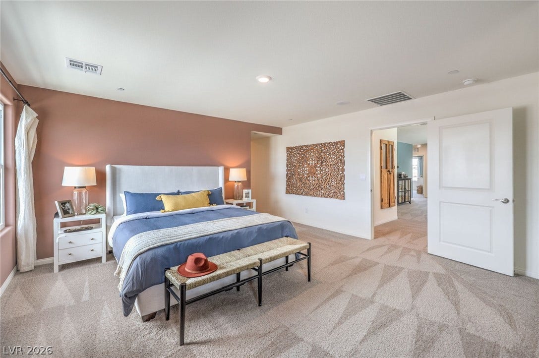 1030 PEACOCK PLUME Avenue, Henderson, NV 89011 Bedroom featuring carpet and multiple windows. Photo is representational only; actual home finishes may vary.
