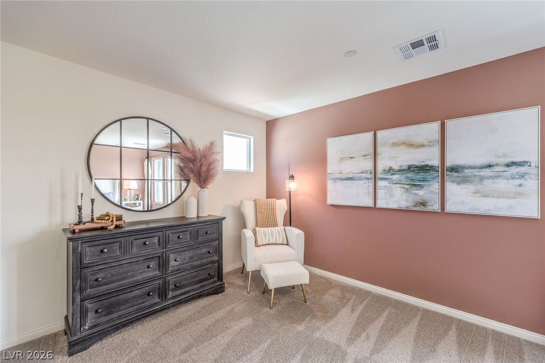 1030 PEACOCK PLUME Avenue, Henderson, NV 89011 Photo is representational only; actual home finishes may vary. Sitting room with carpet flooring and baseboards