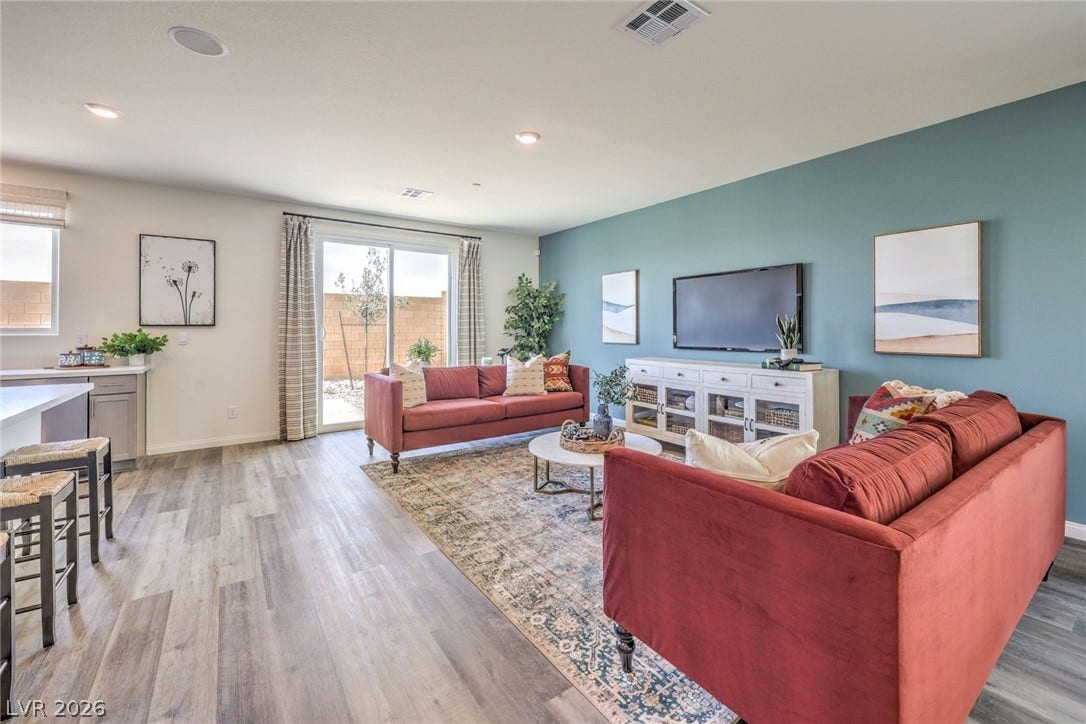 1030 PEACOCK PLUME Avenue, Henderson, NV 89011 Living area with light wood-style flooring, baseboards, and recessed lighting. Photo is representational only; actual home finishes may vary