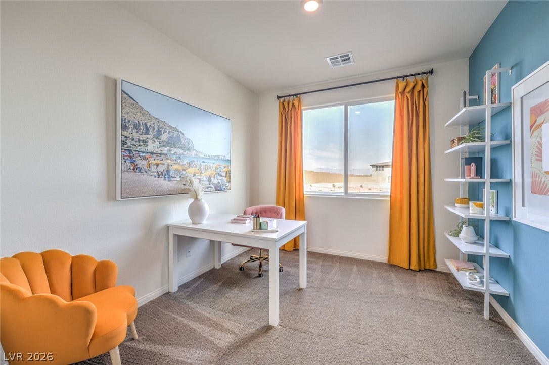 Office featuring carpet flooring, baseboards, and visible vents.Photos are of a model home and are for representational purposes only.