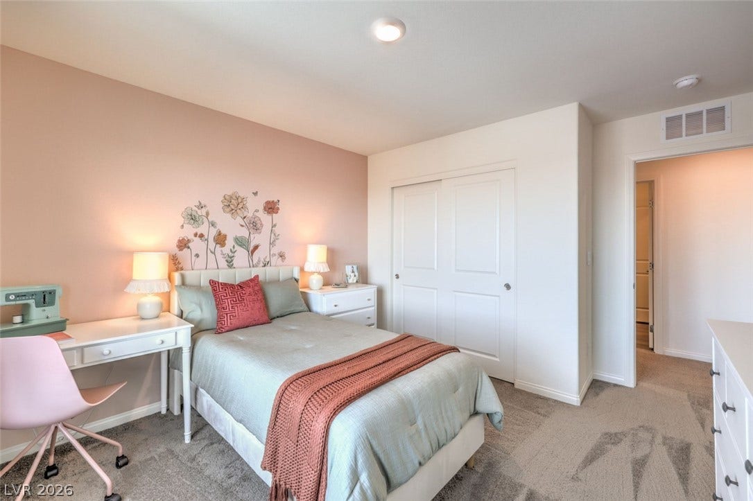 Bedroom with light colored carpet, visible vents, a closet, and baseboards.Photos are of a model home and are for representational purposes only.