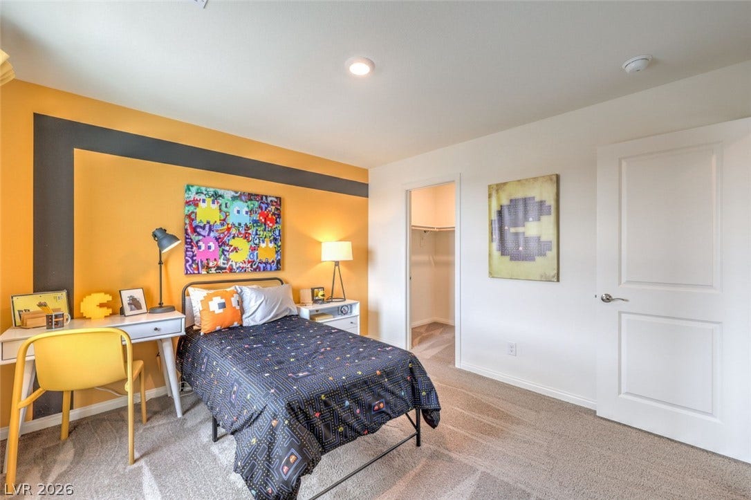 Bedroom featuring baseboards, carpet floors, a closet, and a spacious closet.Photos are of a model home and are for representational purposes only.