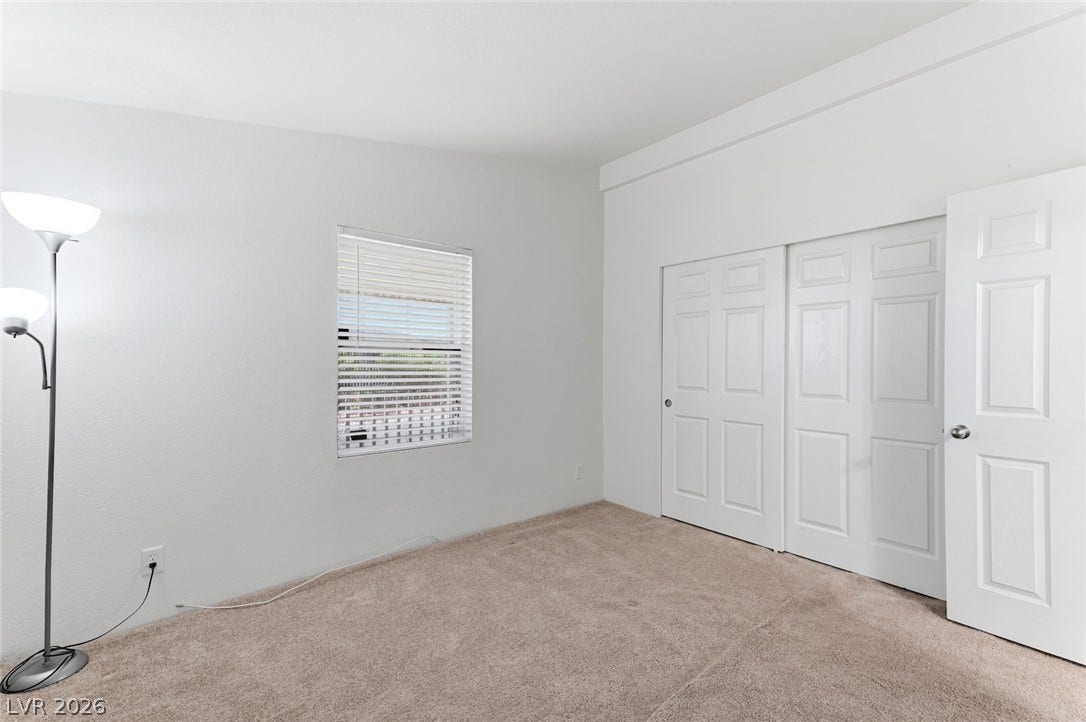 4589 Royal Ridge Boulevard, Las Vegas, NV 89103 A well-proportioned bedroom with ample natural light and generous closet space awaits.