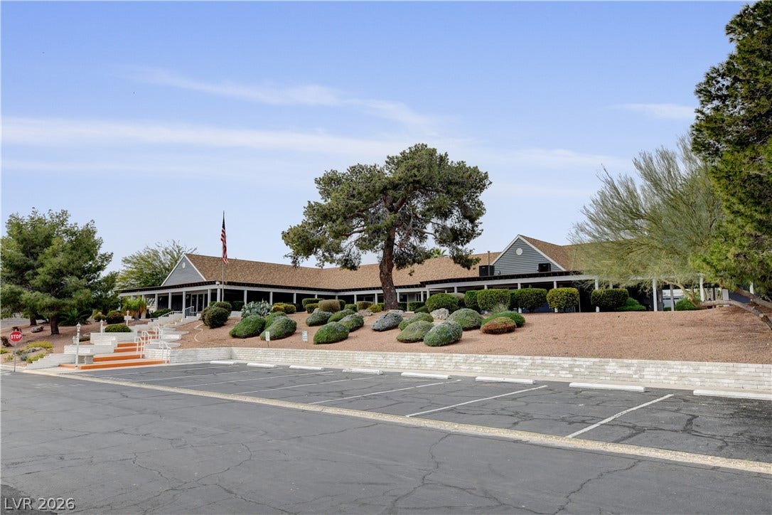 4589 Royal Ridge Boulevard, Las Vegas, NV 89103 A welcoming clubhouse with desert landscaping and ample parking awaits residents.