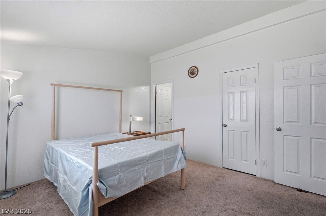 4589 Royal Ridge Boulevard, Las Vegas, NV 89103 Well-lit sleeping quarters with plush carpeting and convenient closet access.