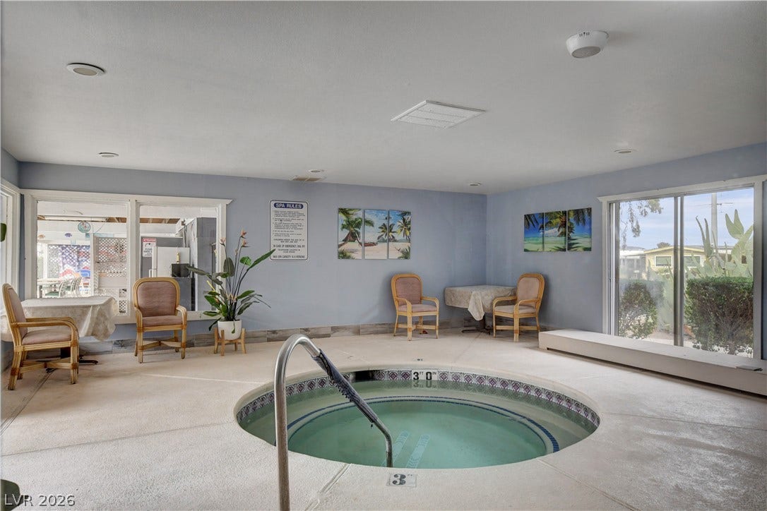 4589 Royal Ridge Boulevard, Las Vegas, NV 89103 An inviting indoor spa with generous natural light offers a perfect relaxation spot.