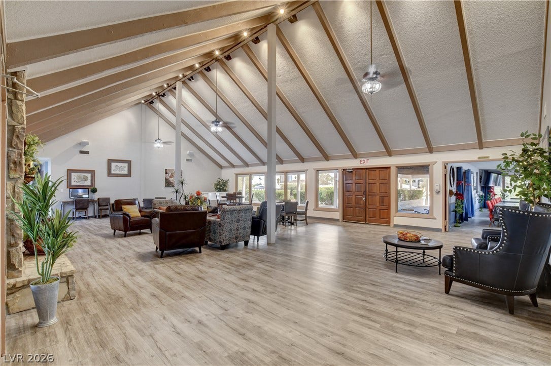 4589 Royal Ridge Boulevard, Las Vegas, NV 89103 A spacious common area with vaulted ceilings and abundant natural light offers a welcoming atmosphere.