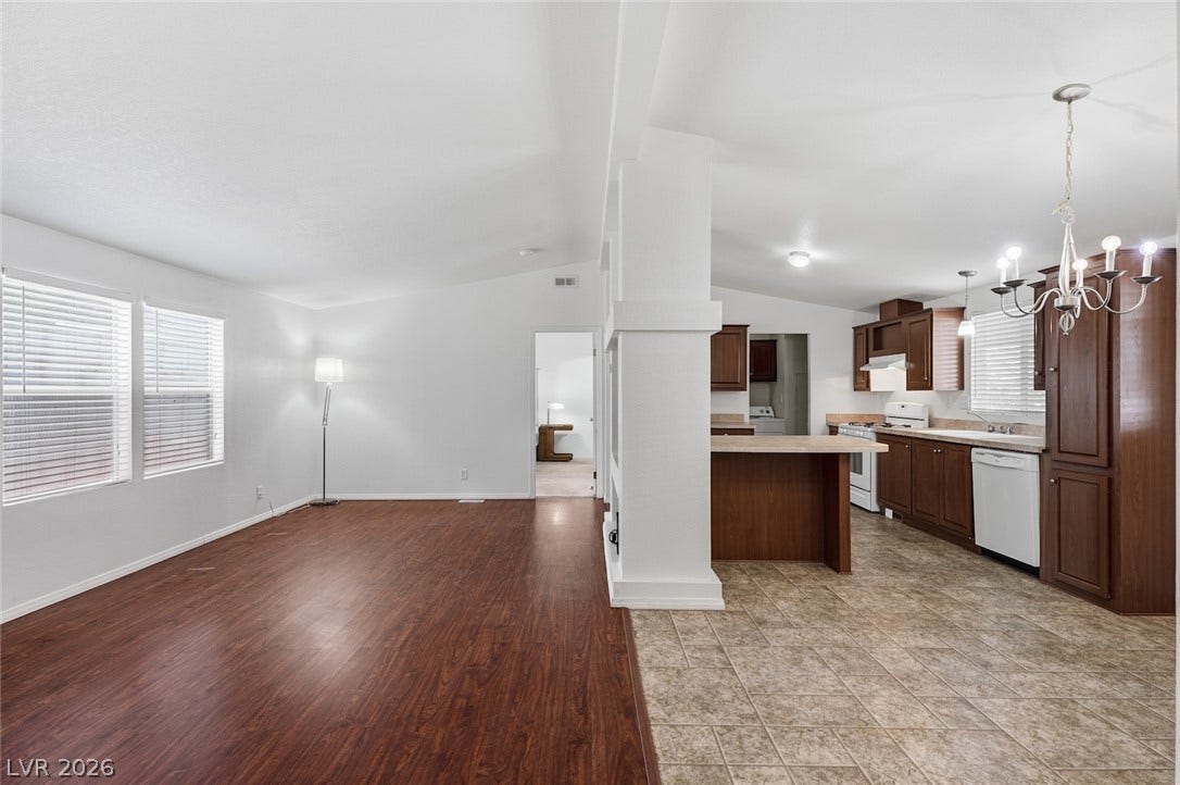 4589 Royal Ridge Boulevard, Las Vegas, NV 89103 An open-concept layout unites the kitchen and living room, creating a seamless flow for daily living.