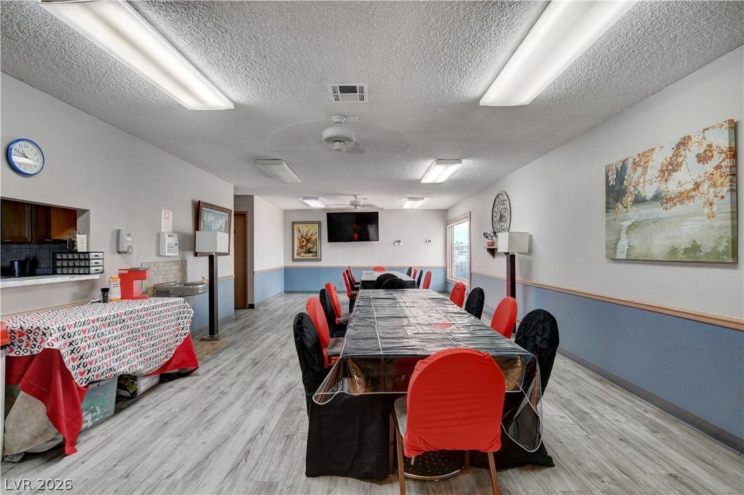 4589 Royal Ridge Boulevard, Las Vegas, NV 89103 A versatile event space offers ample room for gatherings, featuring durable flooring and functional overhead lighting.