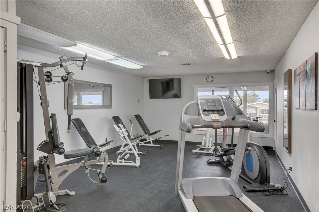 4589 Royal Ridge Boulevard, Las Vegas, NV 89103 Well-equipped fitness center offering a variety of workout options with natural light.