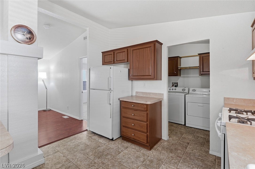 4589 Royal Ridge Boulevard, Las Vegas, NV 89103 A functional kitchen with separate laundry facilities offers everyday convenience.