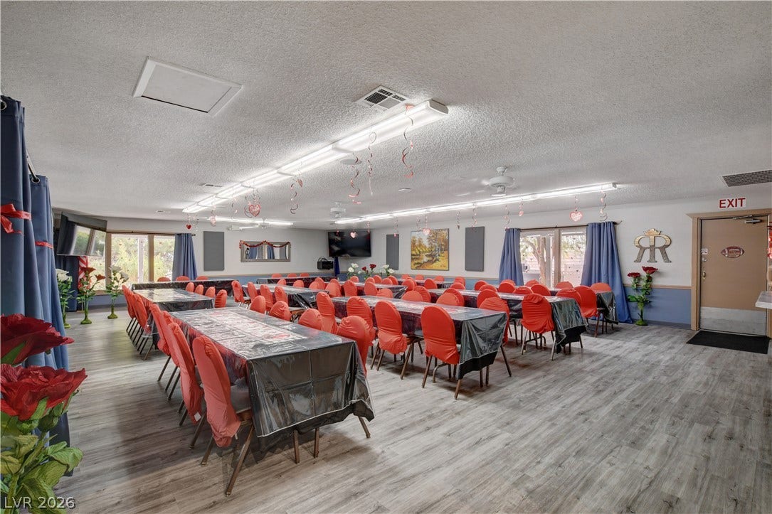 4589 Royal Ridge Boulevard, Las Vegas, NV 89103 An accommodating, spacious room presents an ideal setting for gatherings and events, with durable flooring.