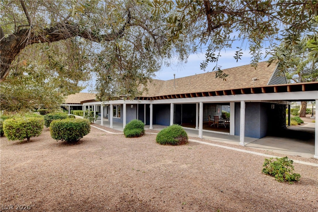 4589 Royal Ridge Boulevard, Las Vegas, NV 89103 A long, covered patio provides ample space for outdoor living and entertaining, overlooking a well-maintained landscape.