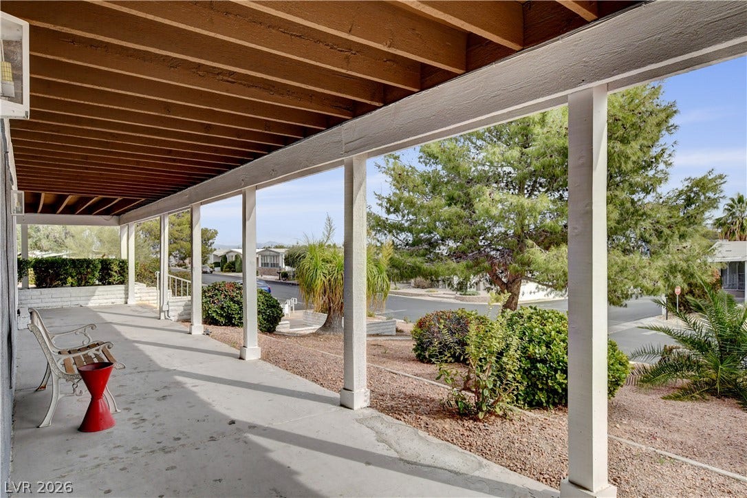 4589 Royal Ridge Boulevard, Las Vegas, NV 89103 A spacious covered patio offers a comfortable outdoor living area with views of the neighborhood.