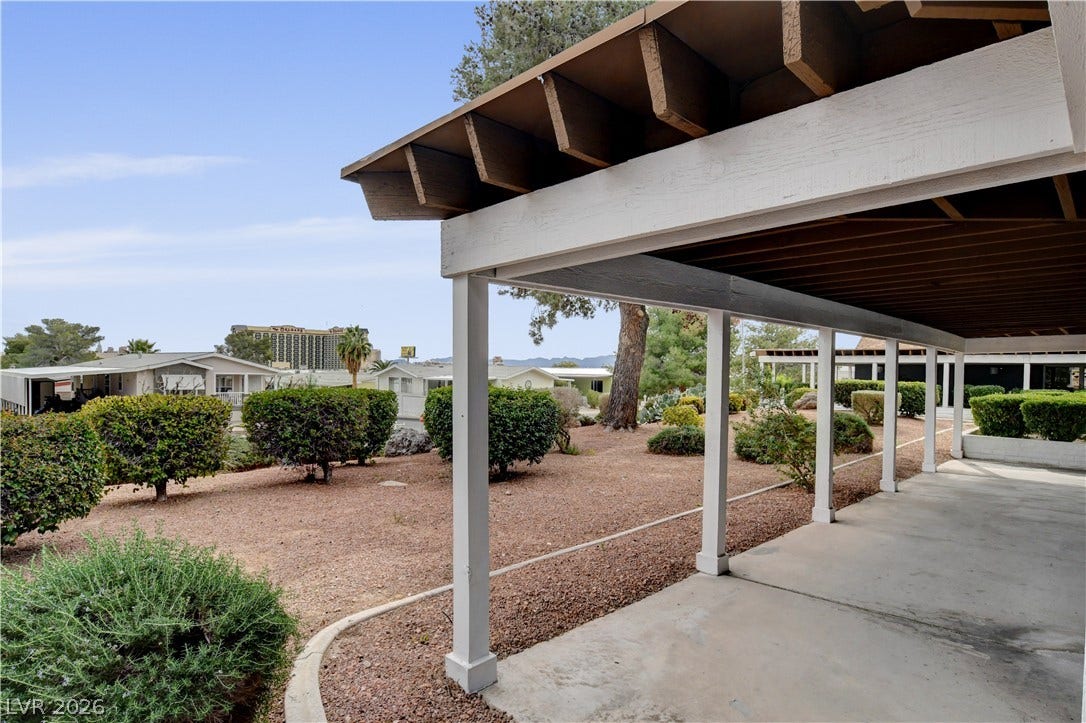 4589 Royal Ridge Boulevard, Las Vegas, NV 89103 A sheltered concrete parking area offers convenient vehicle protection with an inviting view of the landscaped surroundings.