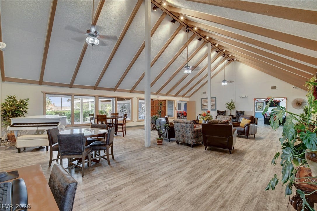 4589 Royal Ridge Boulevard, Las Vegas, NV 89103 A spacious common room features vaulted ceilings, track lighting, and a blend of seating areas.