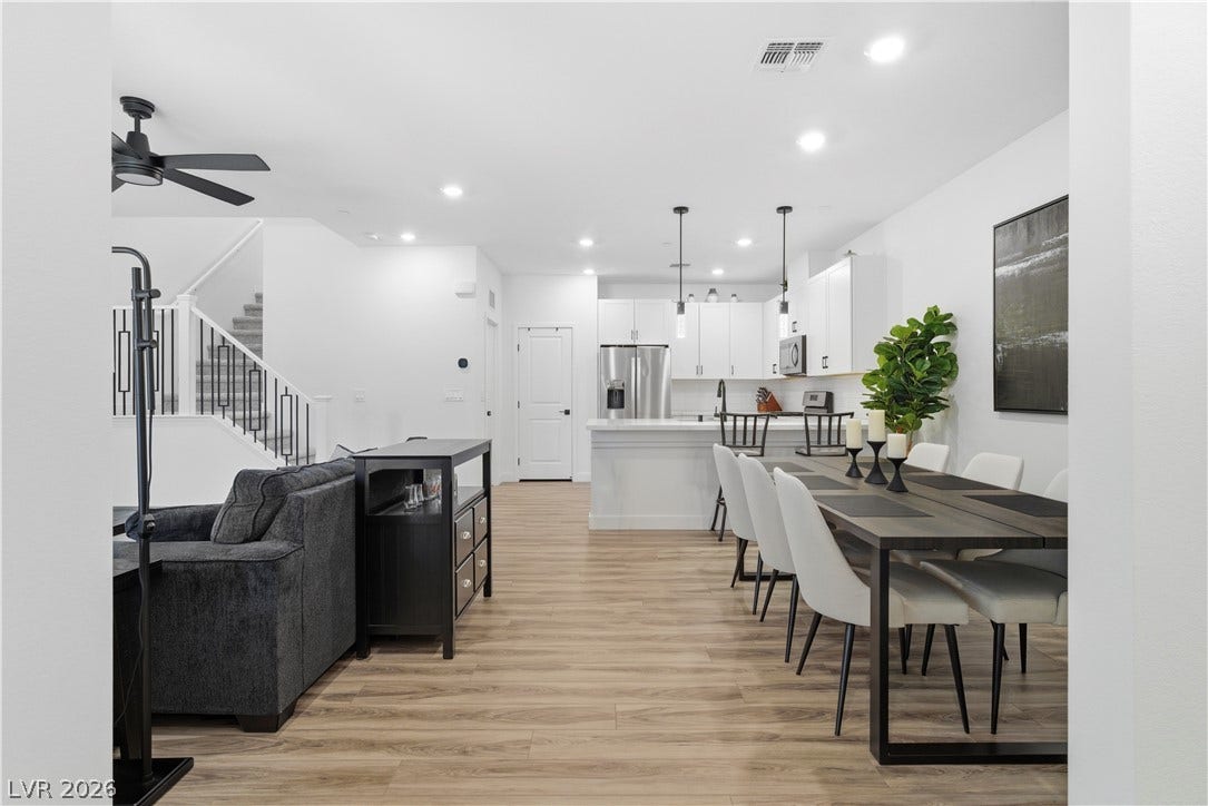 An open-concept interior unites kitchen, dining, and living spaces for effortless modern living.
