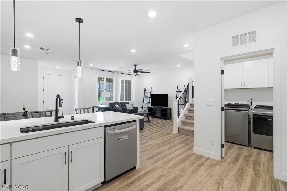 Bright, open-concept living space integrates a well-appointed kitchen with seamless flow into the living area.