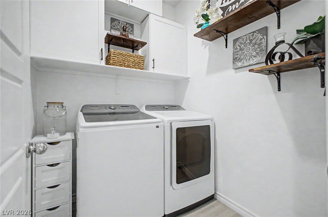 290 Fossil Falls Street, Henderson, NV 89015 Functional laundry room featuring built-in shelving, providing ample storage space.
