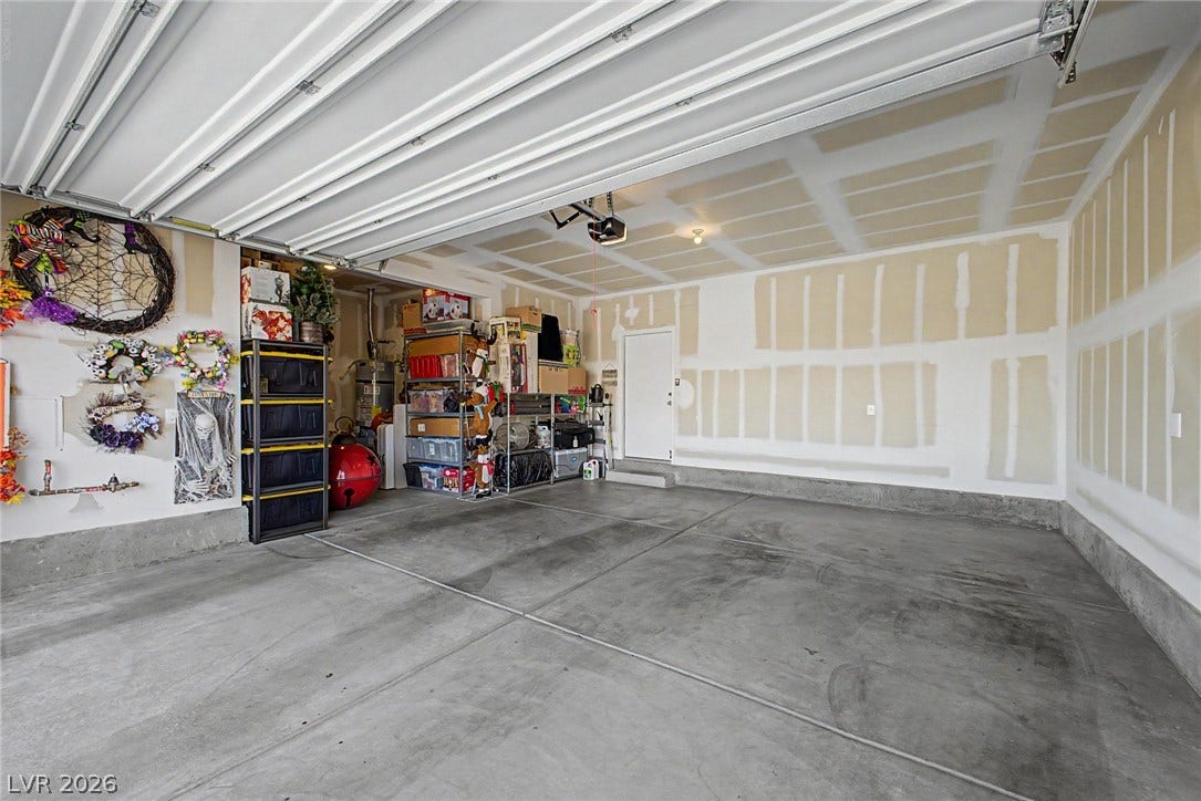 290 Fossil Falls Street, Henderson, NV 89015 A spacious, clean garage offers abundant storage solutions and direct home access.