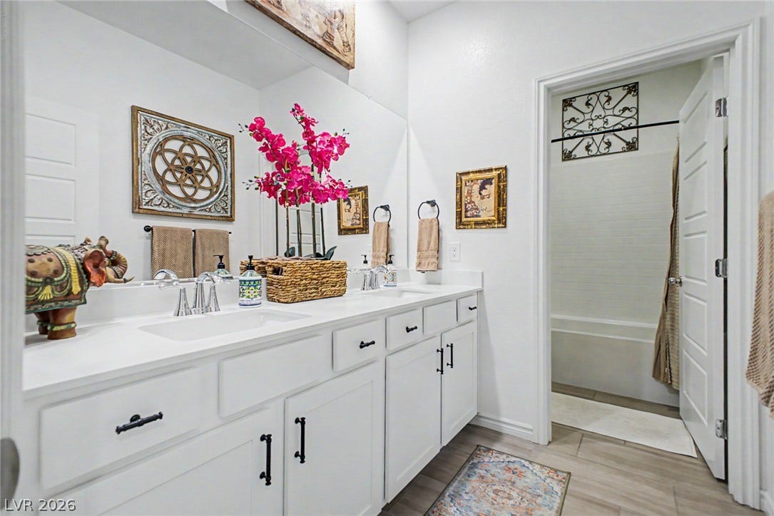 290 Fossil Falls Street, Henderson, NV 89015 Double vanities and ample storage define this bright and practical bathroom.