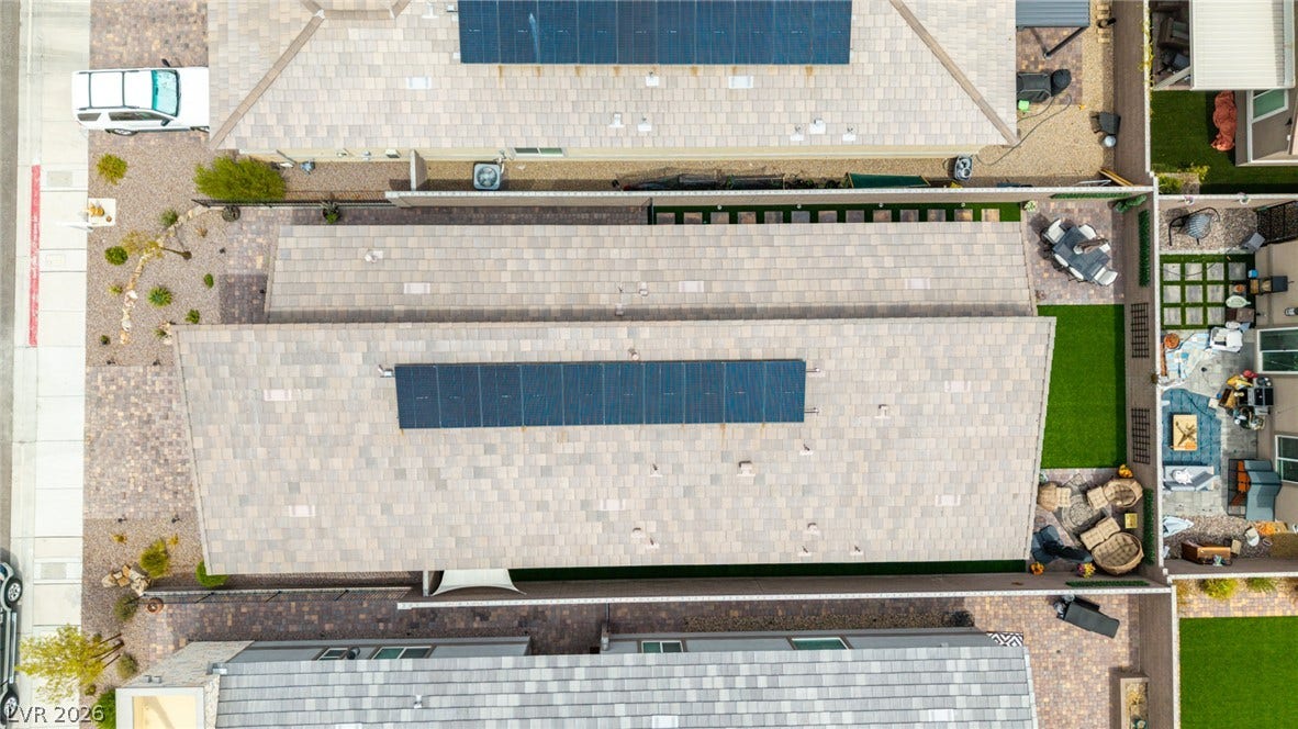 290 Fossil Falls Street, Henderson, NV 89015 Overhead view reveals solar panels enhancing energy efficiency and private yards with diverse landscaping.