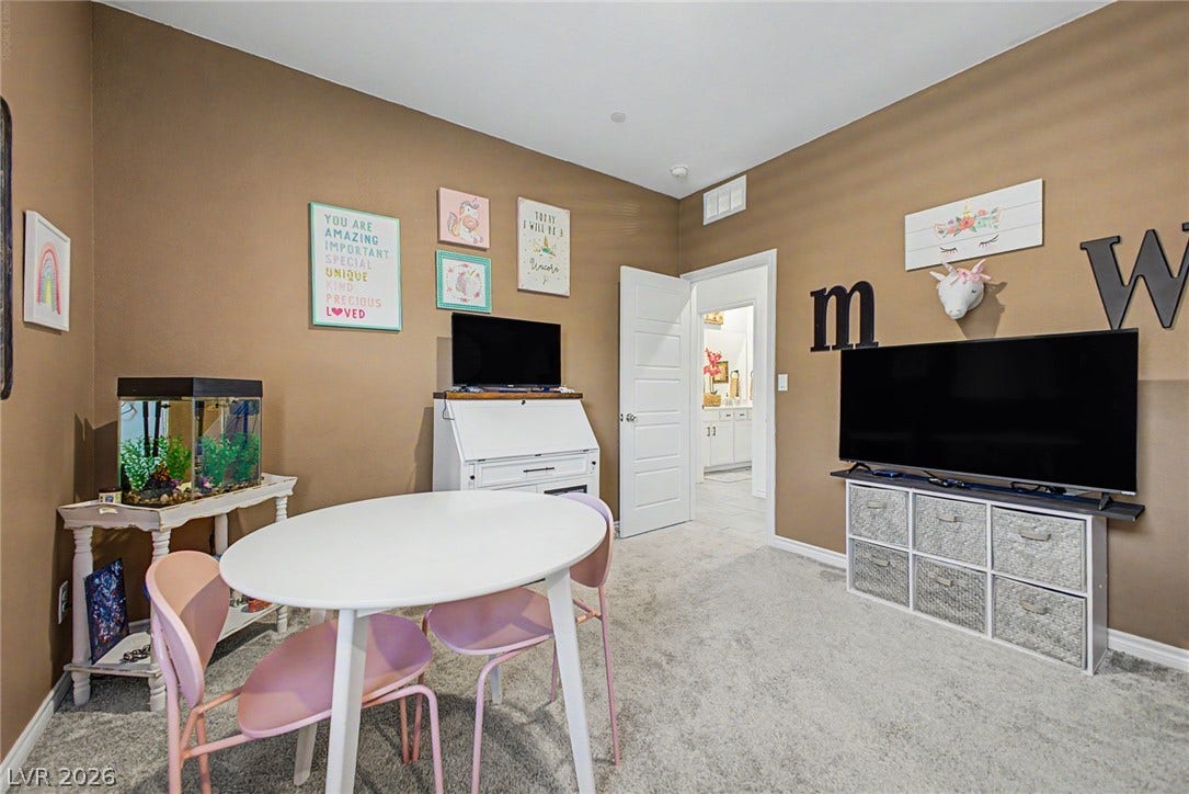 290 Fossil Falls Street, Henderson, NV 89015 Plush carpeting defines this playful space, offering comfort and versatility for various activities.