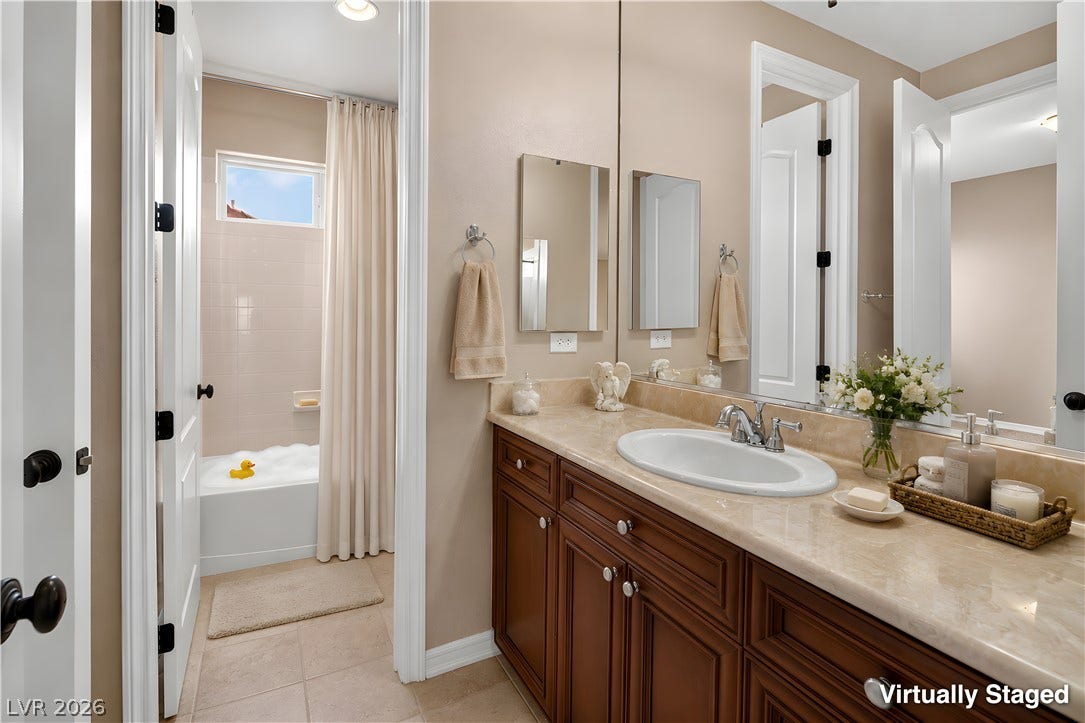 30 Benevolo Drive, Henderson, NV 89011 A well-appointed bathroom features a generously sized vanity with ample storage and a private bath area.