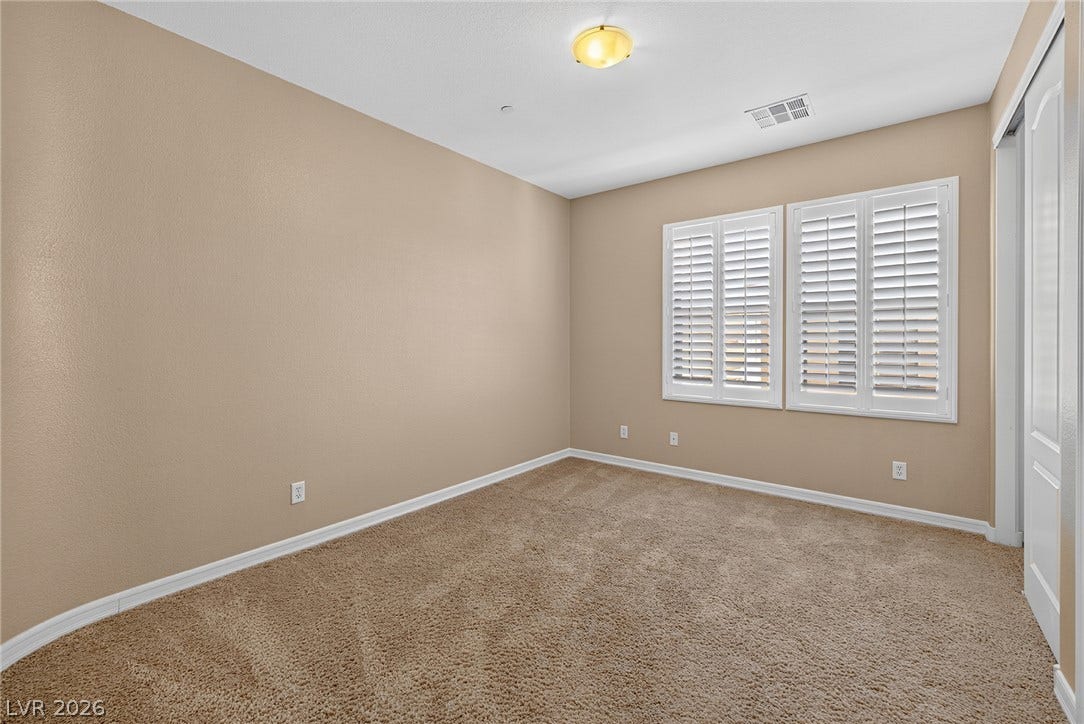 30 Benevolo Drive, Henderson, NV 89011 A well-proportioned bedroom with ample natural light offers a comfortable retreat.