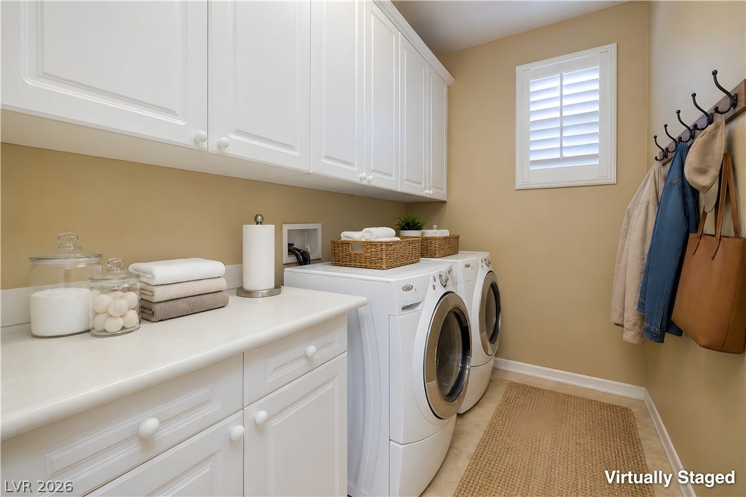 30 Benevolo Drive, Henderson, NV 89011 Functional laundry room equipped with white cabinetry, ample counter space, and modern appliances.
