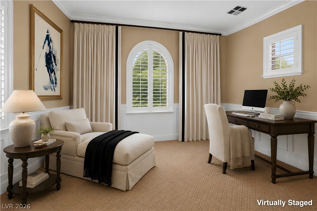 30 Benevolo Drive, Henderson, NV 89011 A well-lit home office features an arched window with classic shutters and warm wall tones.