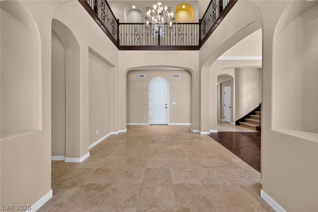 30 Benevolo Drive, Henderson, NV 89011 A grand entry with soaring ceilings and decorative wrought iron balcony railings welcomes you home.