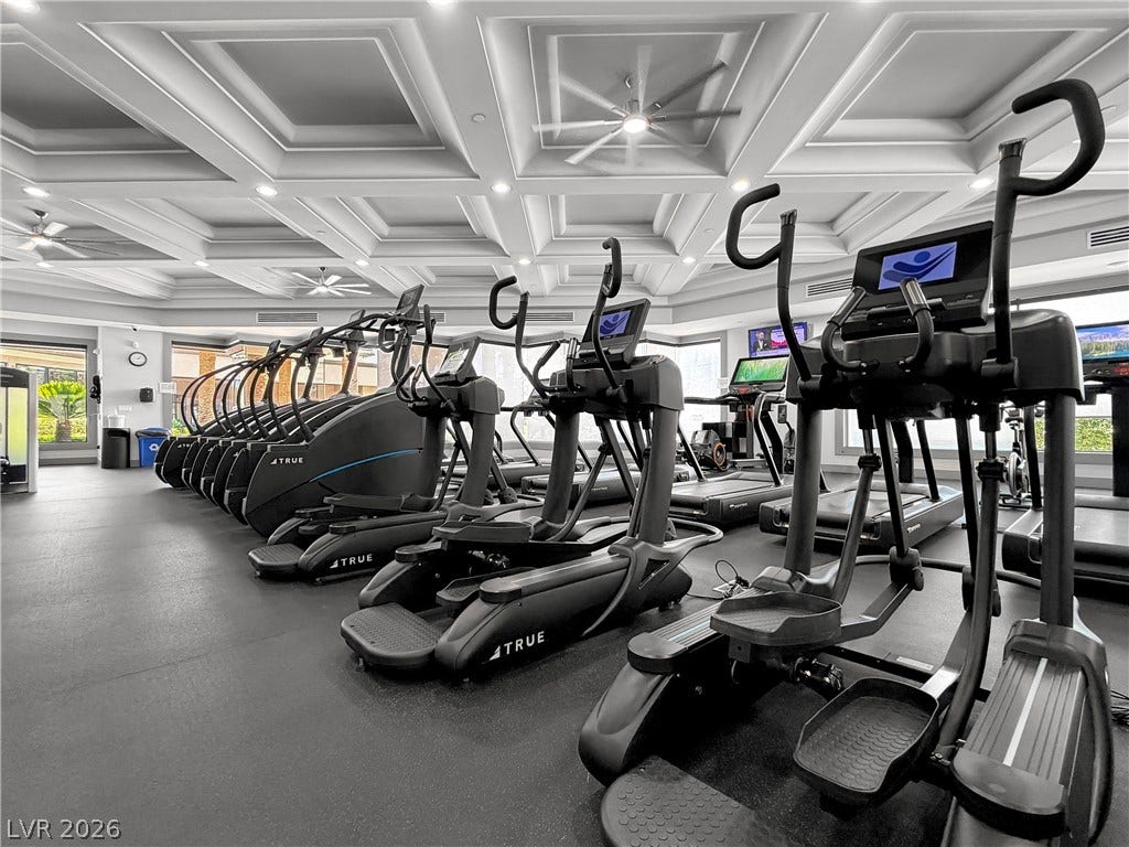 771 White Dogwood Court, Las Vegas, NV 89148 Fitness enthusiasts will appreciate this well-equipped gym with ample exercise machines and elegant coffered ceilings.