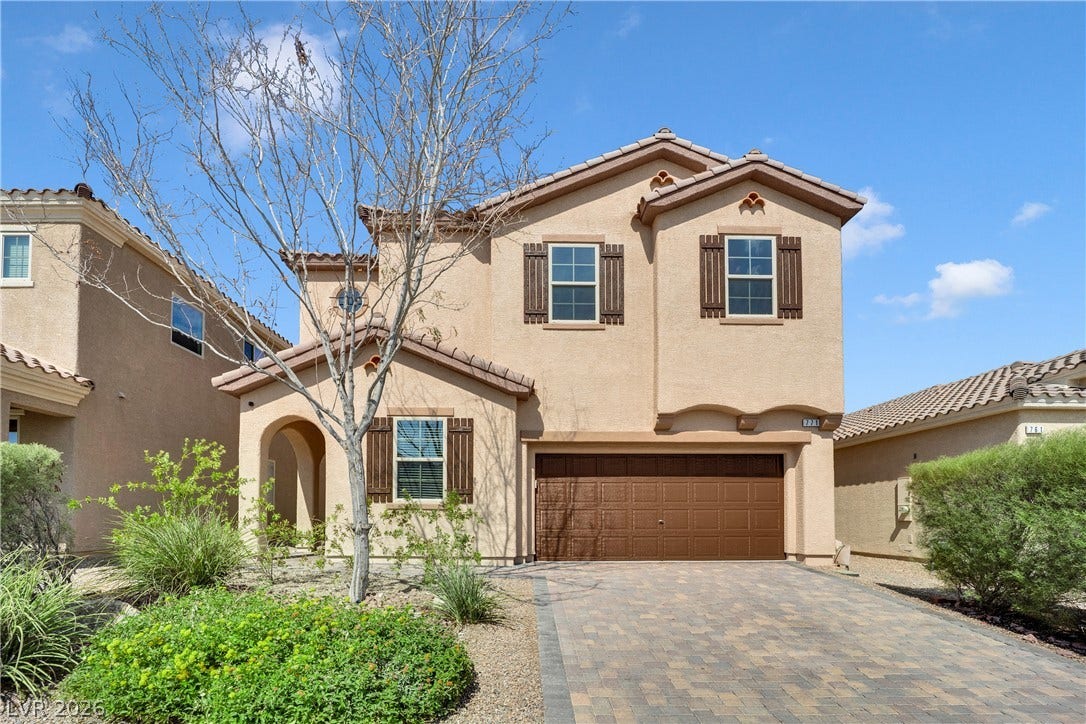 771 White Dogwood Court, Las Vegas, NV 89148 A well-maintained stucco facade with traditional window shutters and a paver driveway enhance this home's curb appeal.