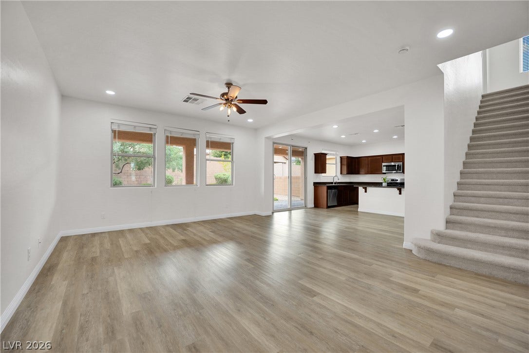 771 White Dogwood Court, Las Vegas, NV 89148 An open floorplan seamlessly connects the airy living area with the adjoining kitchen space.
